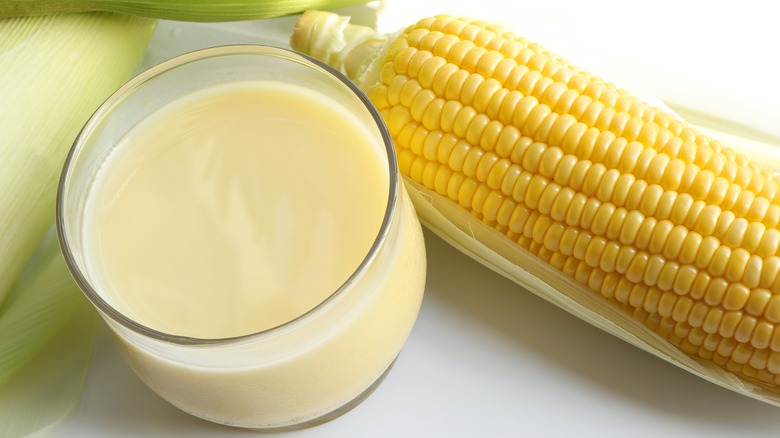 corn on the cob with glass of milk