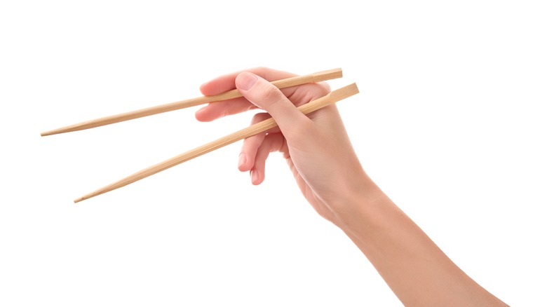 Person using chopsticks