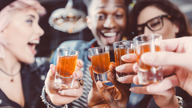 Friends toasting with shots