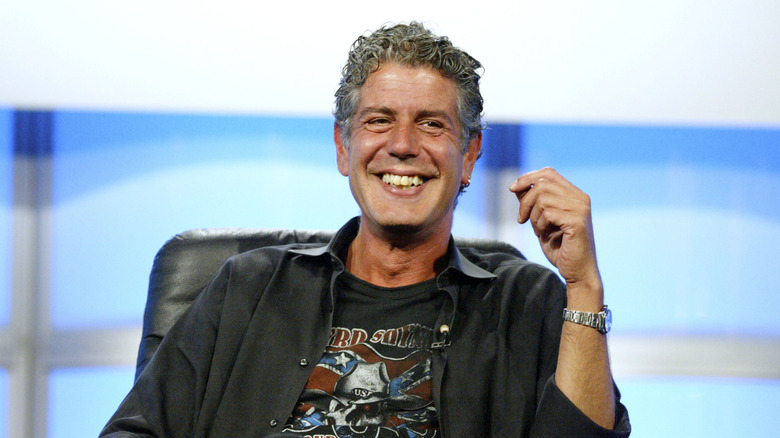 Anthony Bourdain smiling in chair