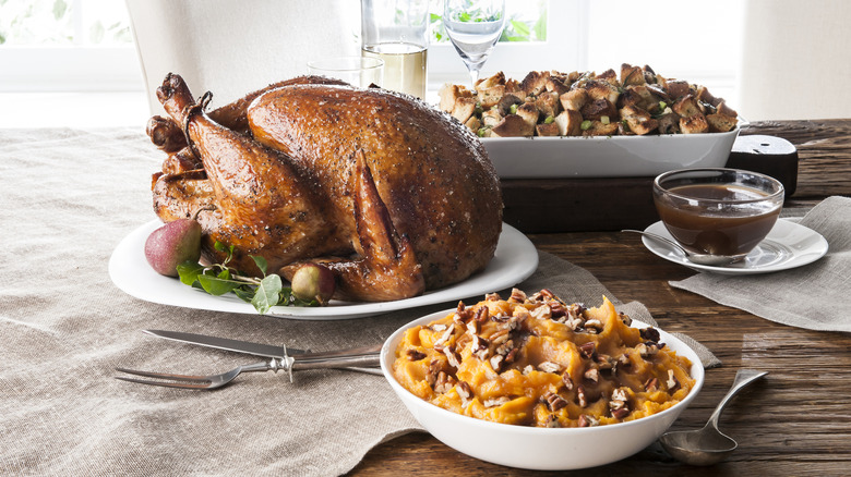 Thanksgiving turkey on a table with sides