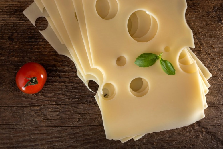 Why does Swiss cheese have holes? 