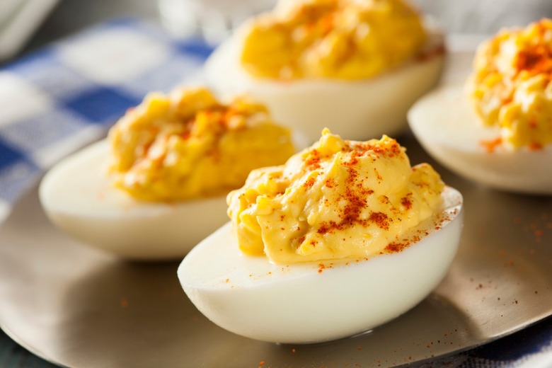 Where does the term 'deviled' come from in deviled eggs?