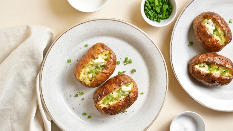 Baked potatoes with butter and chives