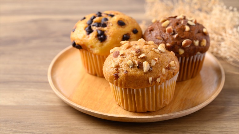 three different muffins on plate