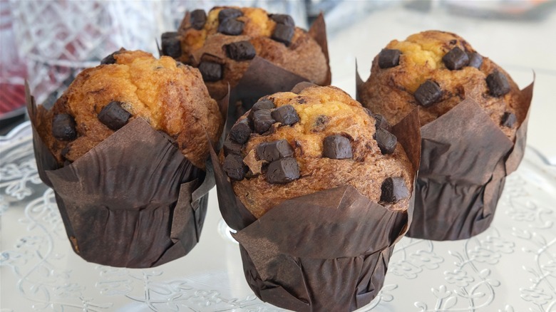 large muffins on glass plate