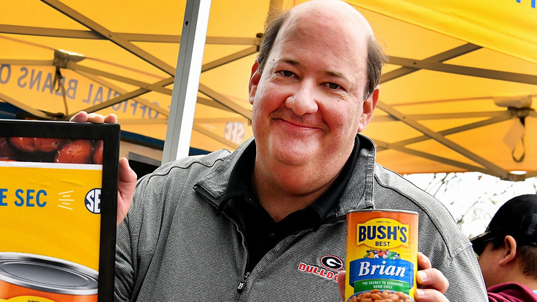 Brian Baumgartner holding a can of chili beans