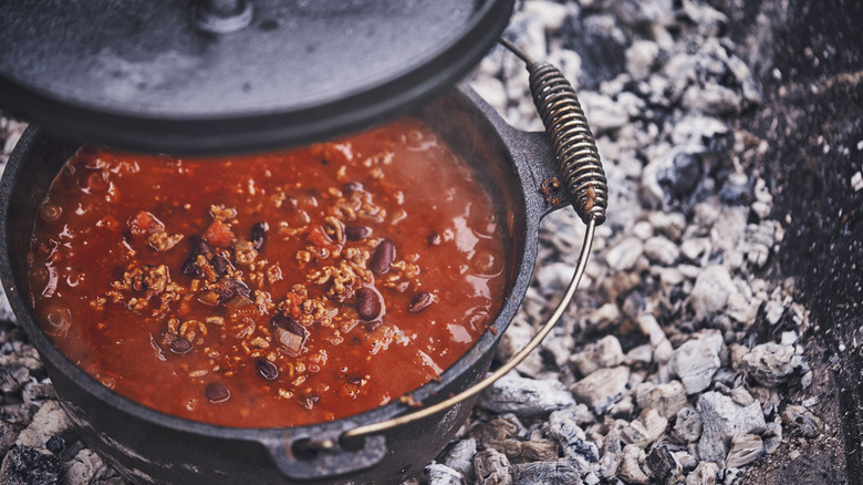 Pot of chili on a coal fire