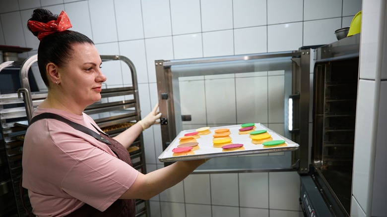 Baker using professional oven