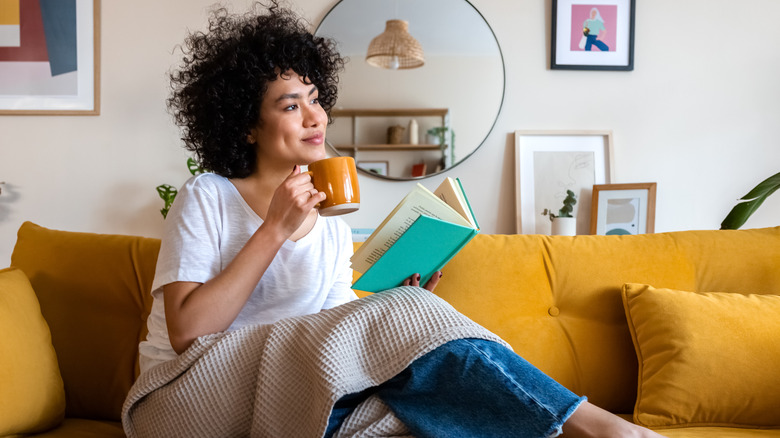 Woman drinking freshly brewed chicory coffee in her living room