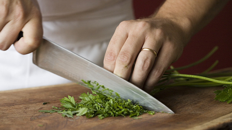 Person chopping herbs