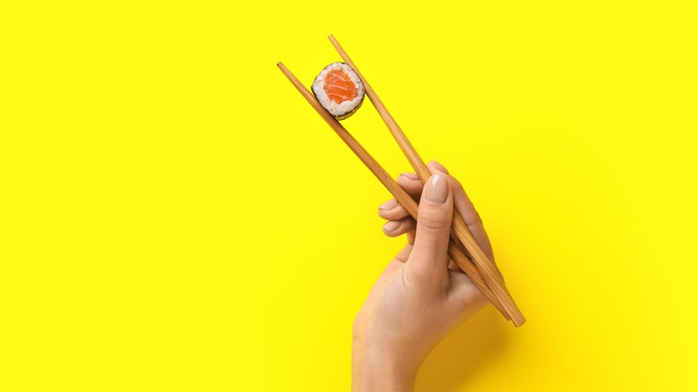 Holding food with chopsticks