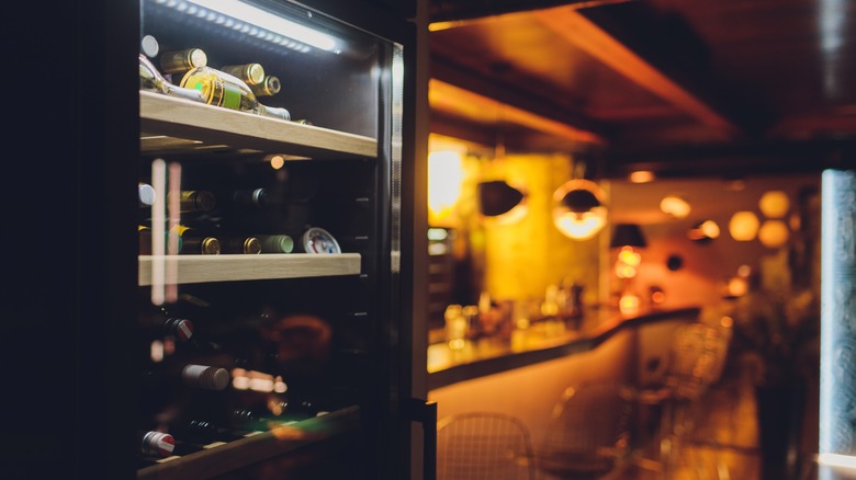 bar refrigerator full of bottles