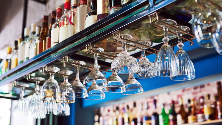 hanging cocktail glasses in bar