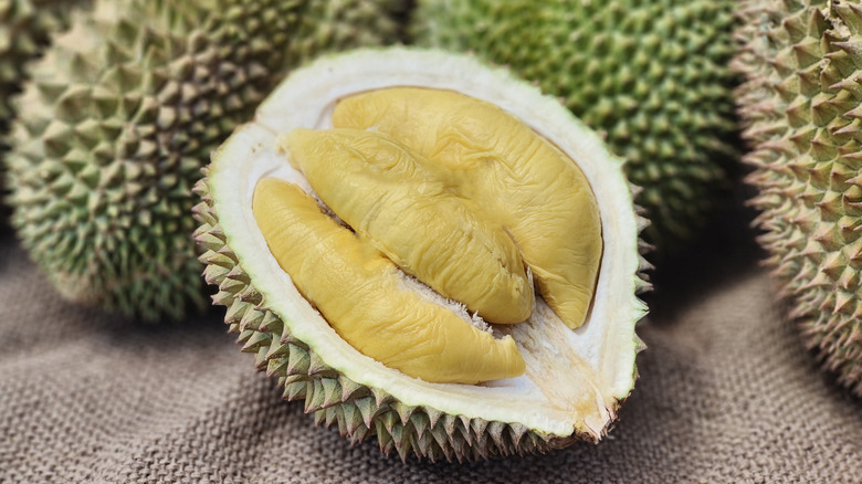 sliced and whole durians