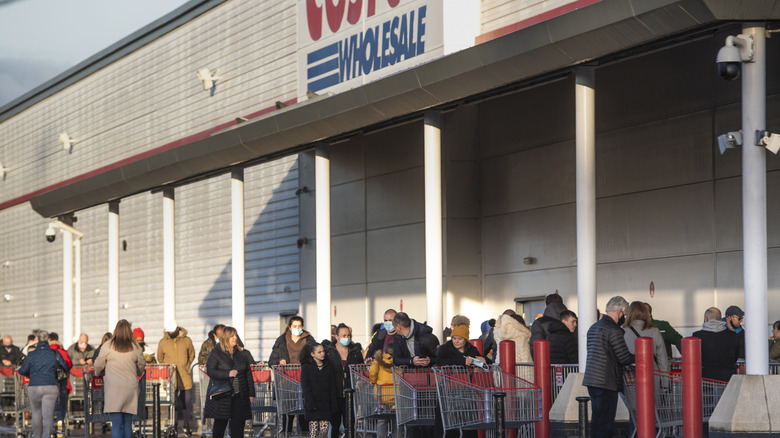 Shoppers waiting in line outside a Costco