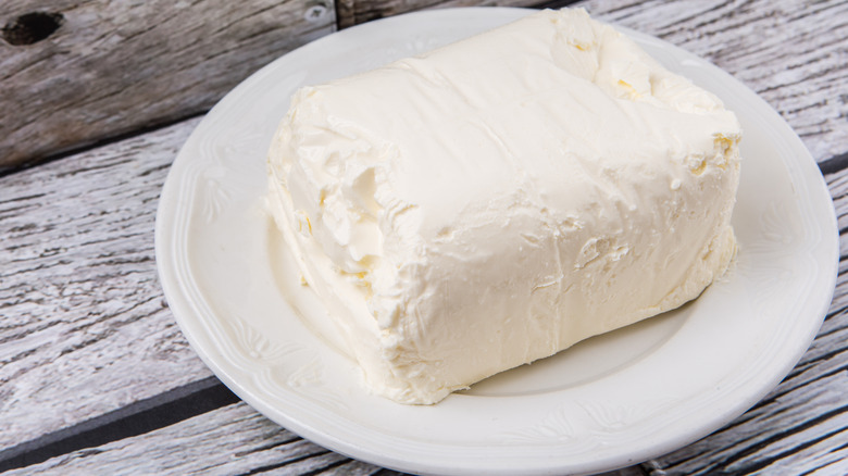 Block of cream cheese on plate