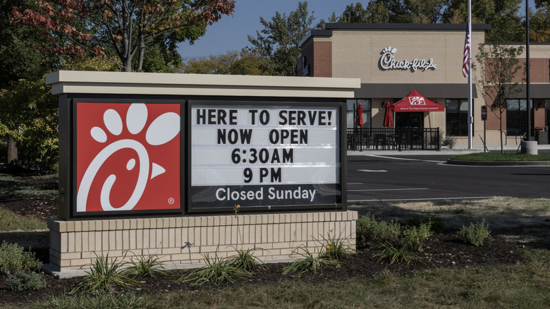 chick fil a sign in front of restaurant