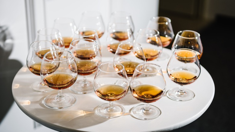 glasses of bourbon on a white table