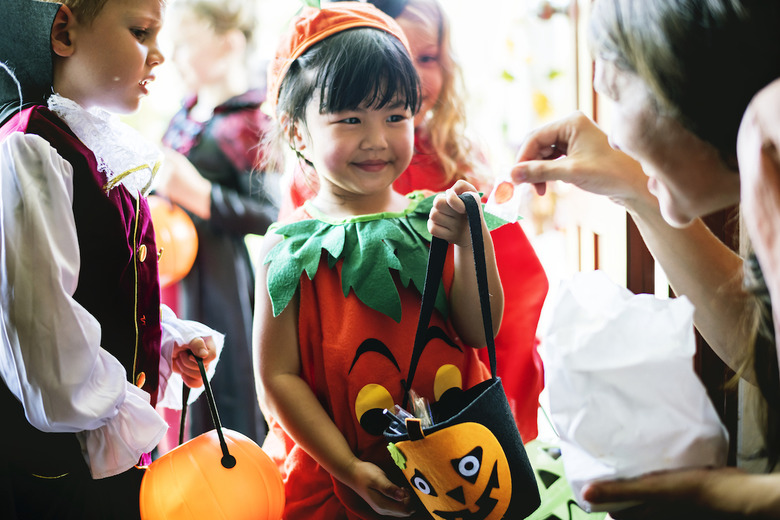 Why do we give out Halloween candy?