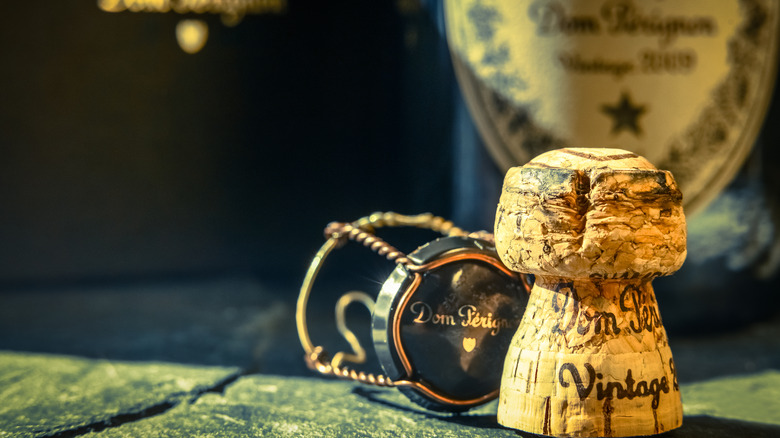 Dom Pérignon cork near a bottle