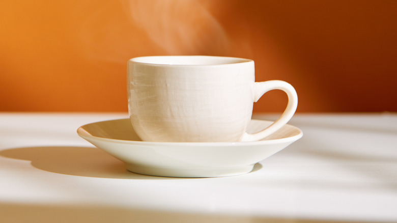 white tea cup with steam