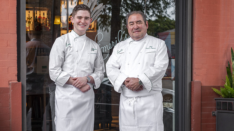 E.J. and Emeril Lagasse at storefront