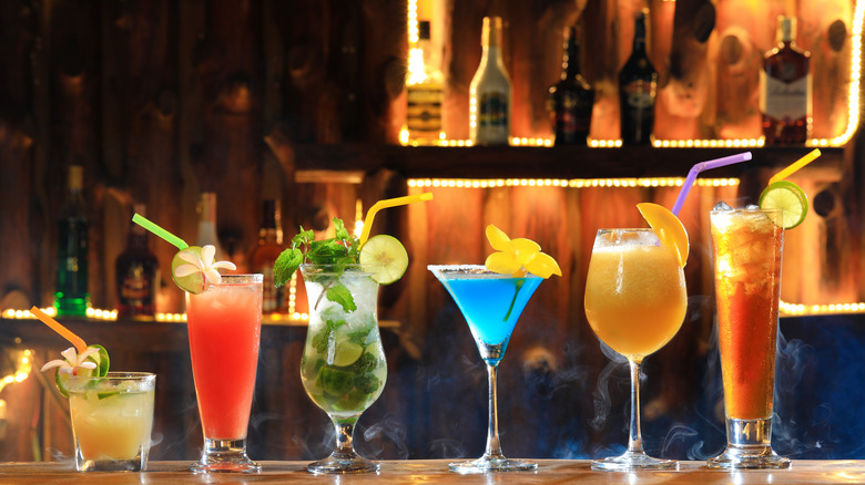 Cocktails lined up on a bar