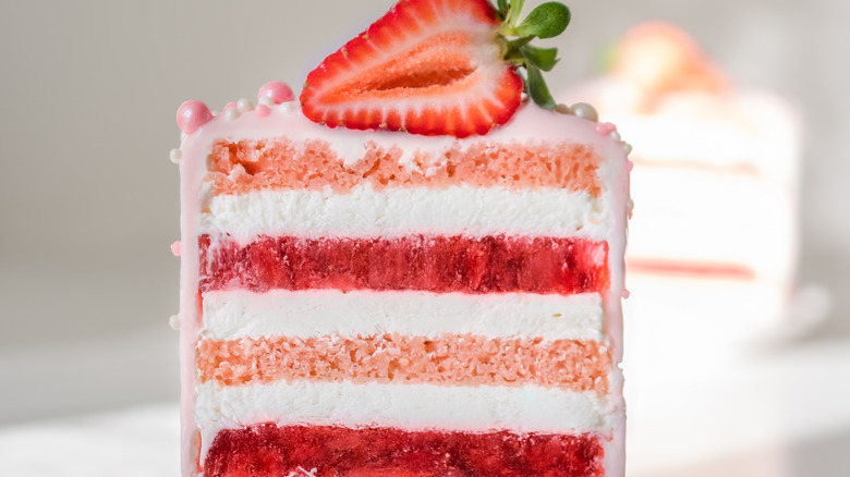 Slice of layered strawberry cake