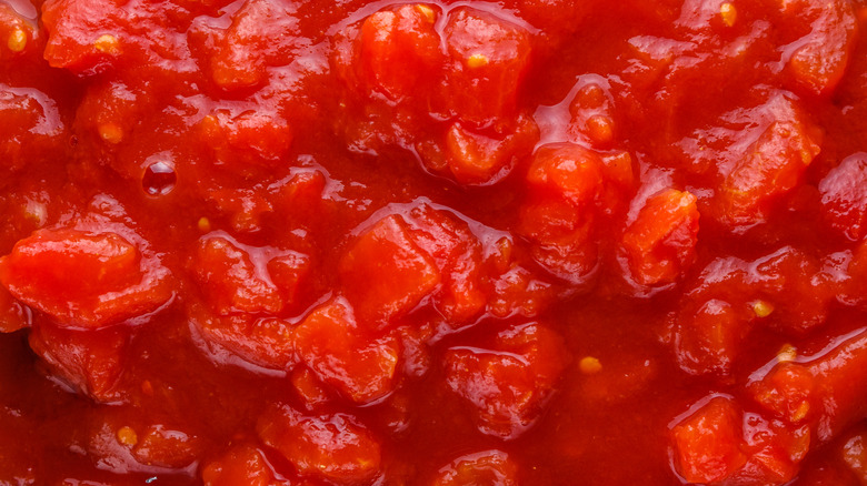 Bowl filled with chopped canned tomatoes