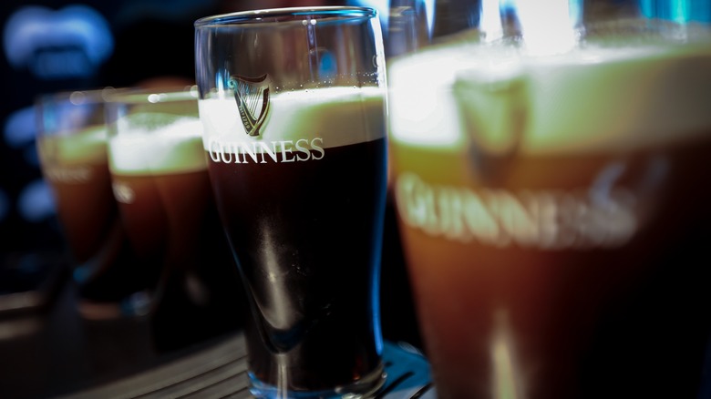 Pints of Guinness being poured