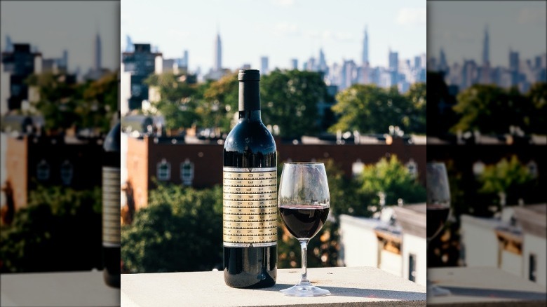 a bottle of the prisoners cabernet sauvignon next to a wine glass