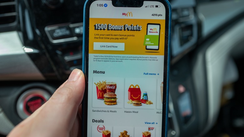 hand holding phone with mcdonalds app open 