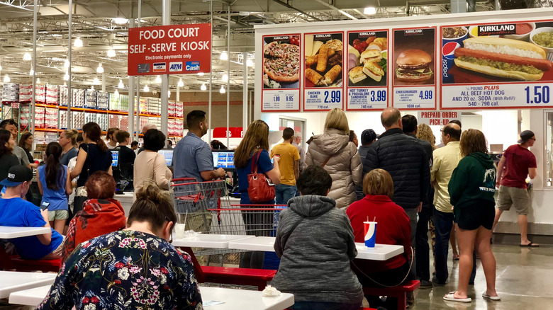 People queuing at a food court in Costco