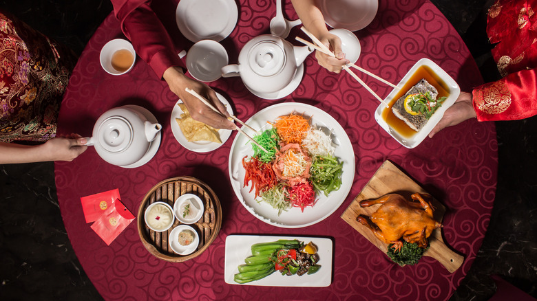 eating from shared plates on table