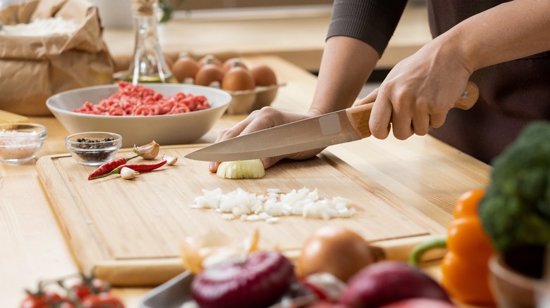 Person chopping onion