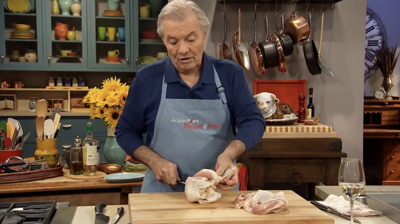 Jacques Pépin carving a chicken