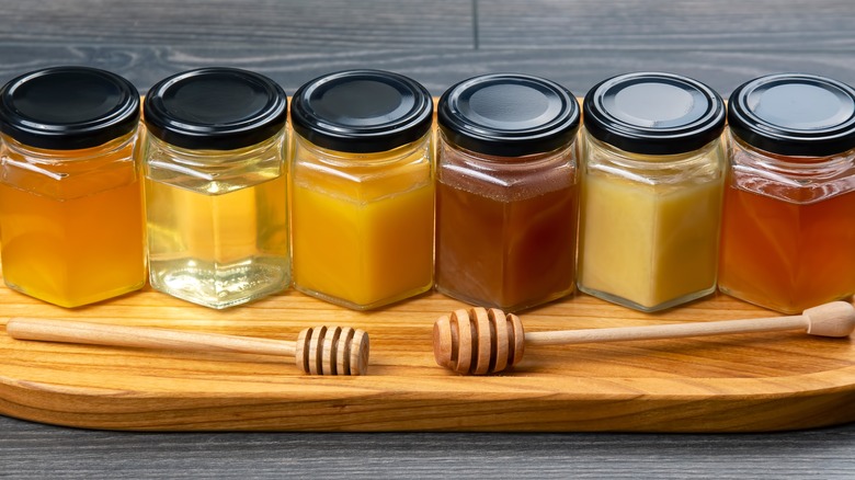 Jars of different colored honey