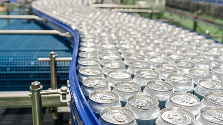 beverage cans in assembly line
