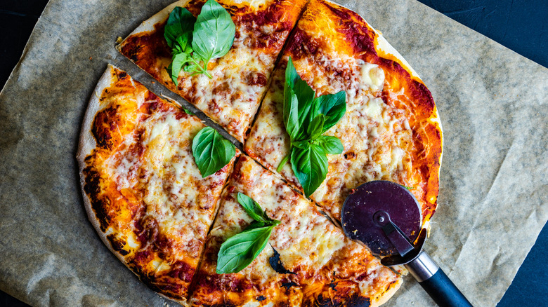 pizza with basil leaves