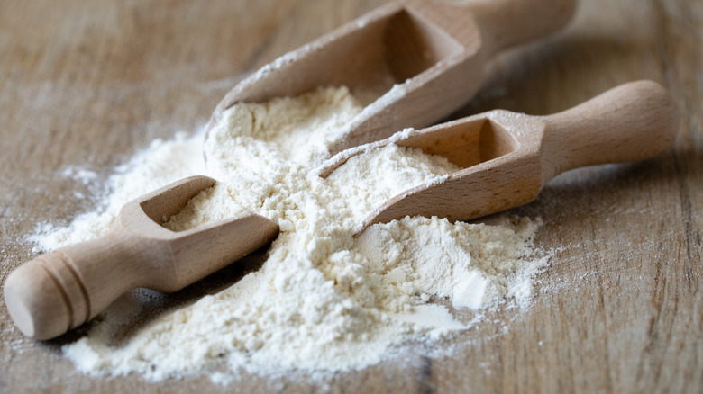 white flour with flour scoops