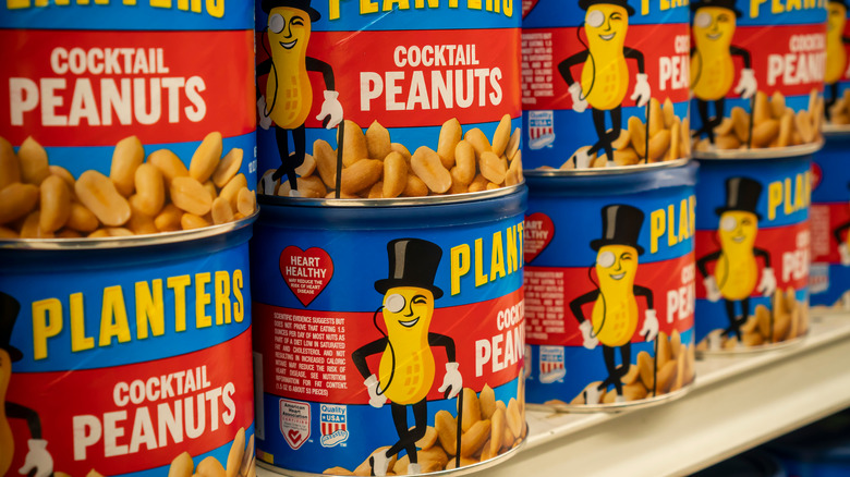 jars of planters peanuts lined up on shelf