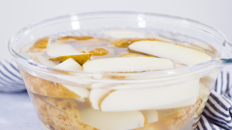 Potato slices soaking in water