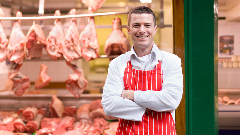 A butcher in a butcher shop