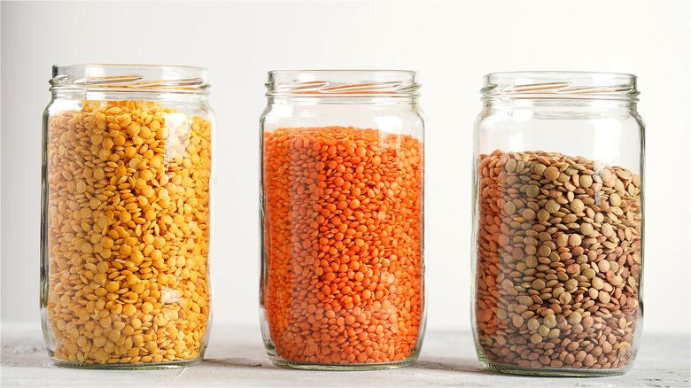 3 jars of different colored lentils 