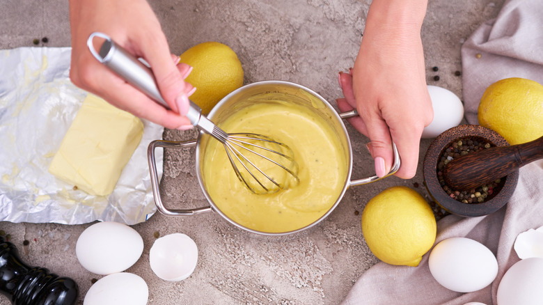 whisking ingredients for hollandaise sauce