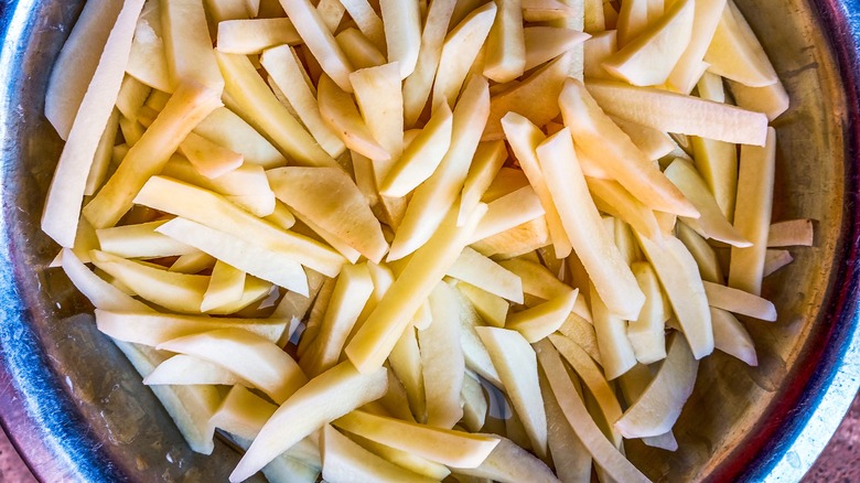 bowl of raw french fries