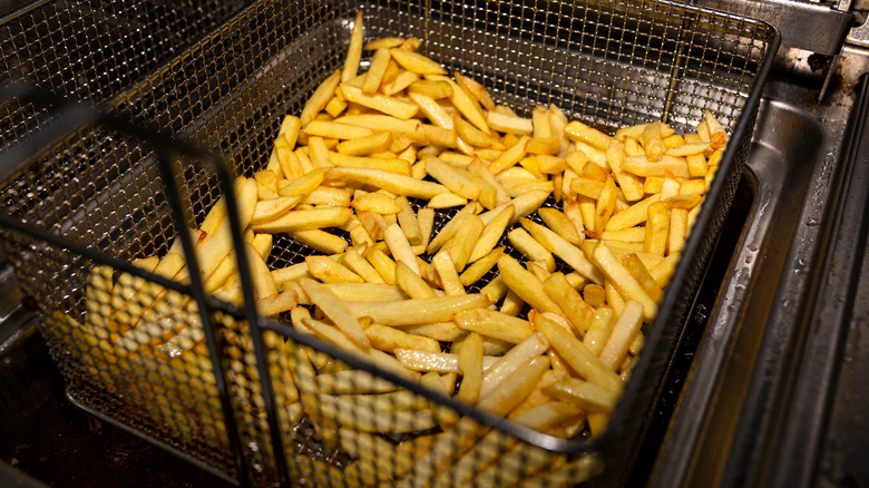 french fries draining in basket