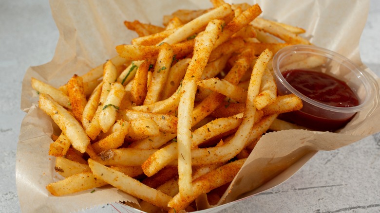 carton of seasoned french fries