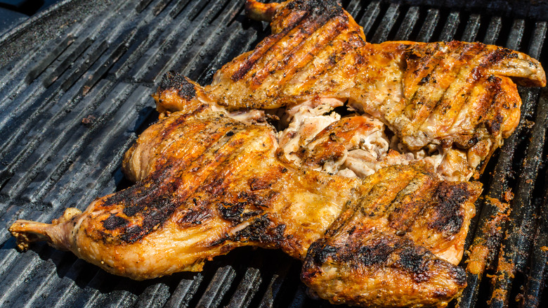 Flattened chicken on grill